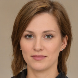 Joyful white young-adult female with long  brown hair and green eyes