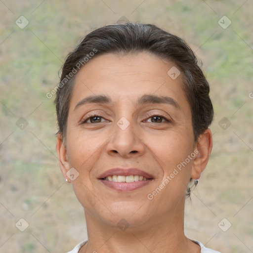 Joyful white adult female with short  brown hair and brown eyes