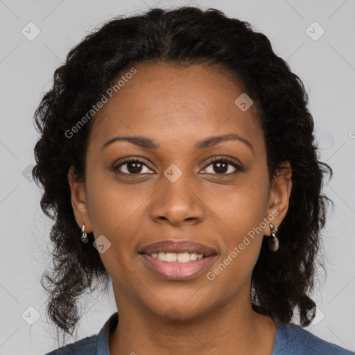 Joyful black young-adult female with long  brown hair and brown eyes