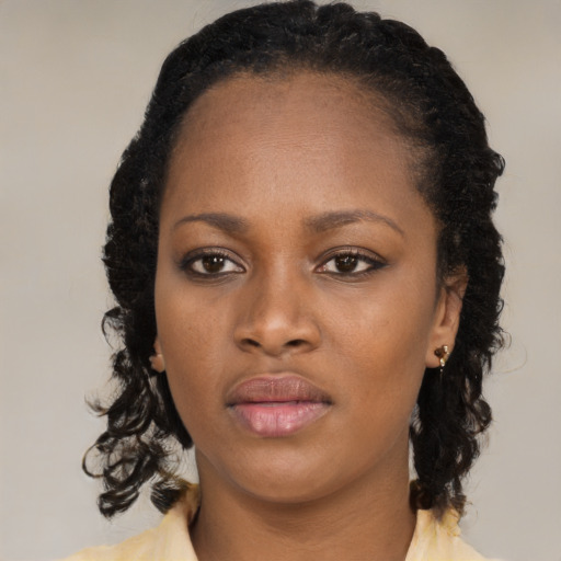 Neutral black young-adult female with medium  black hair and brown eyes