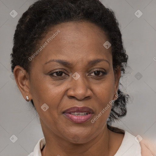 Joyful black adult female with short  brown hair and brown eyes