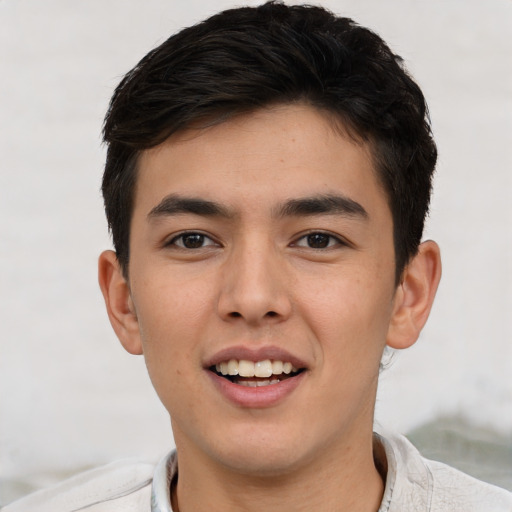 Joyful asian young-adult male with short  brown hair and brown eyes
