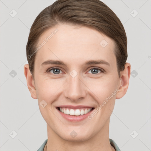 Joyful white young-adult female with short  brown hair and grey eyes