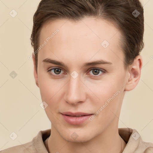 Joyful white young-adult female with short  brown hair and grey eyes