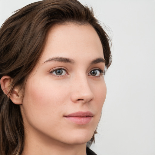 Neutral white young-adult female with long  brown hair and grey eyes