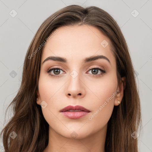 Neutral white young-adult female with long  brown hair and brown eyes