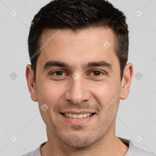 Joyful white young-adult male with short  brown hair and brown eyes