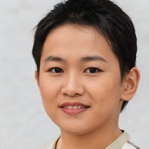 Joyful asian young-adult female with short  brown hair and brown eyes