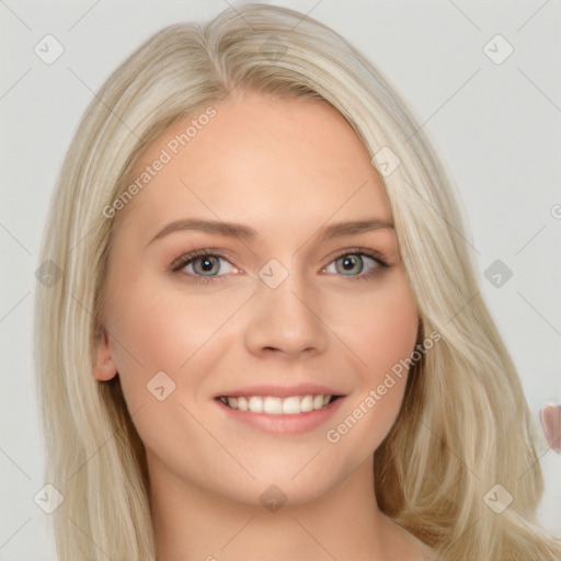 Joyful white young-adult female with long  blond hair and brown eyes