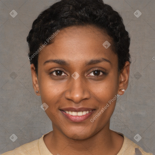 Joyful black young-adult female with short  black hair and brown eyes