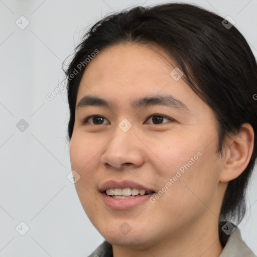 Joyful asian young-adult male with medium  brown hair and brown eyes