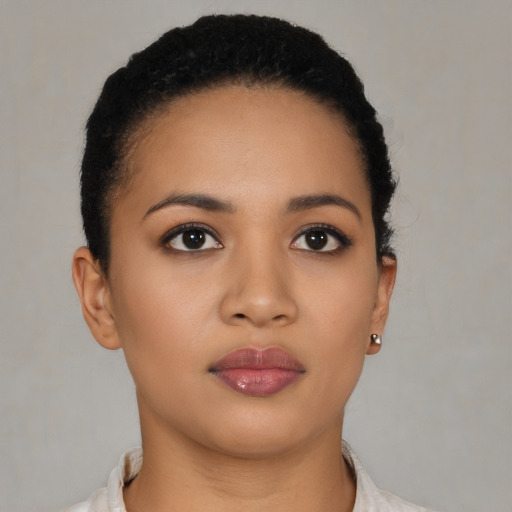 Neutral latino young-adult female with short  black hair and brown eyes