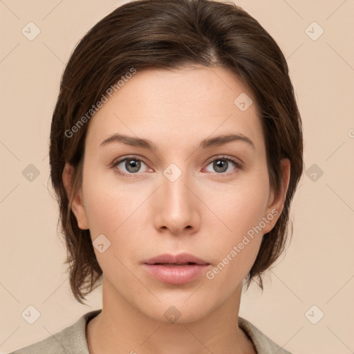 Neutral white young-adult female with medium  brown hair and brown eyes