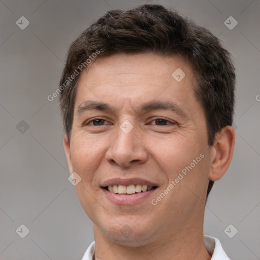 Joyful white adult male with short  brown hair and brown eyes