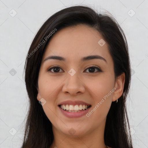 Joyful latino young-adult female with long  brown hair and brown eyes