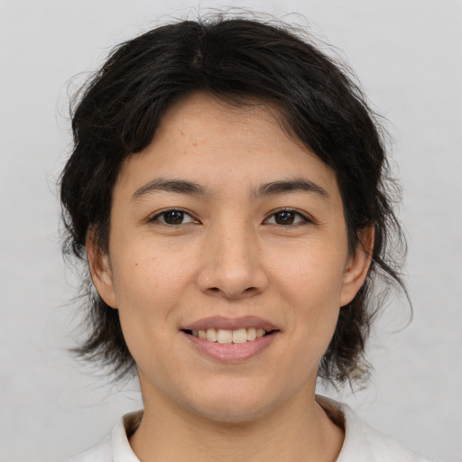 Joyful asian young-adult female with medium  brown hair and brown eyes