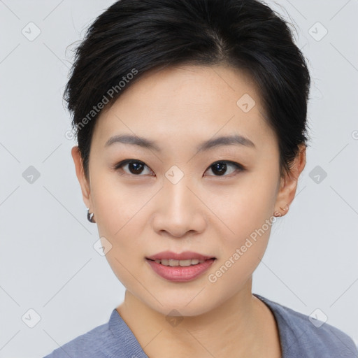 Joyful asian young-adult female with short  brown hair and brown eyes