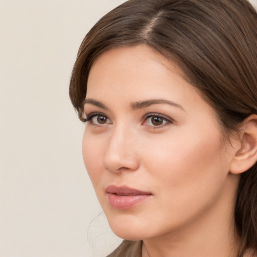 Neutral white young-adult female with medium  brown hair and brown eyes