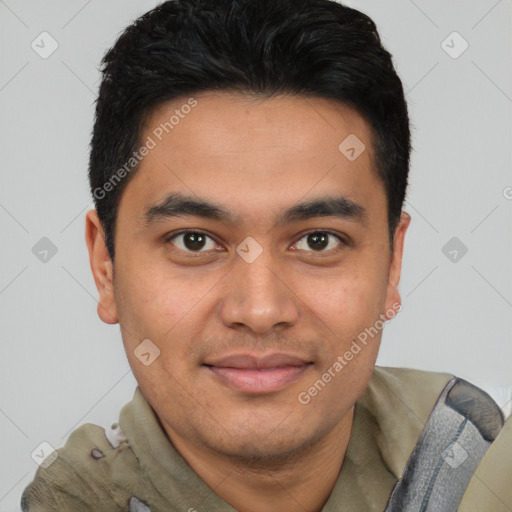 Joyful latino young-adult male with short  brown hair and brown eyes