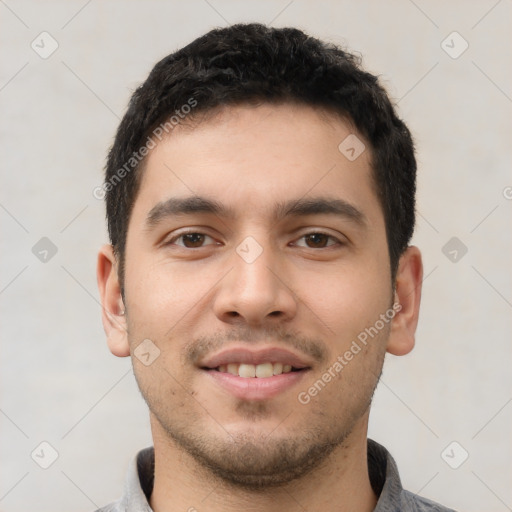 Joyful white young-adult male with short  black hair and brown eyes