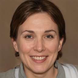 Joyful white adult female with medium  brown hair and brown eyes