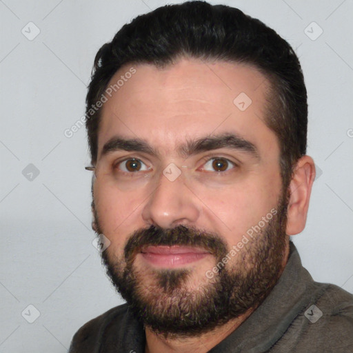 Joyful white adult male with short  black hair and brown eyes