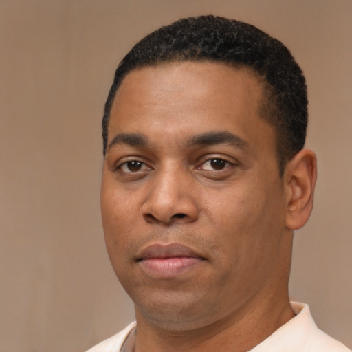 Neutral black young-adult male with short  black hair and brown eyes