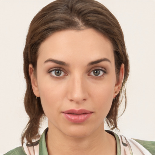 Neutral white young-adult female with medium  brown hair and brown eyes