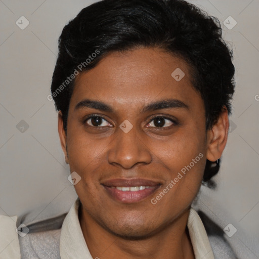 Joyful latino young-adult male with short  brown hair and brown eyes