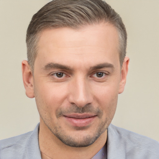 Joyful white adult male with short  brown hair and brown eyes