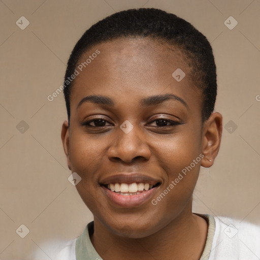 Joyful black young-adult female with short  black hair and brown eyes