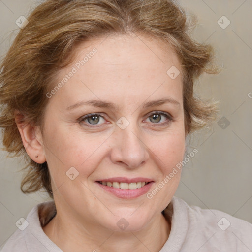 Joyful white young-adult female with medium  brown hair and blue eyes