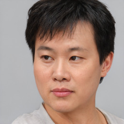 Neutral asian young-adult male with short  brown hair and brown eyes