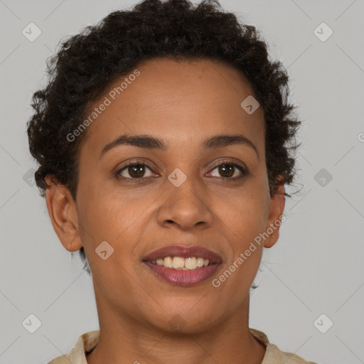 Joyful black adult female with short  brown hair and brown eyes