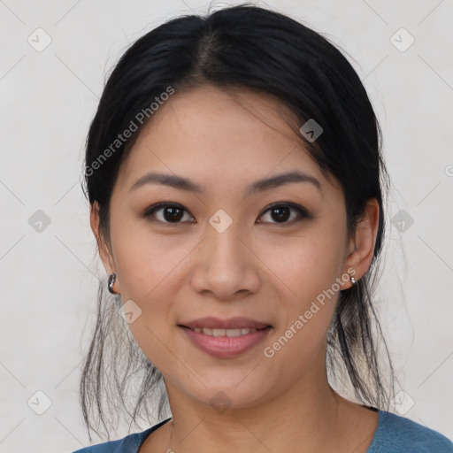 Joyful asian young-adult female with medium  black hair and brown eyes