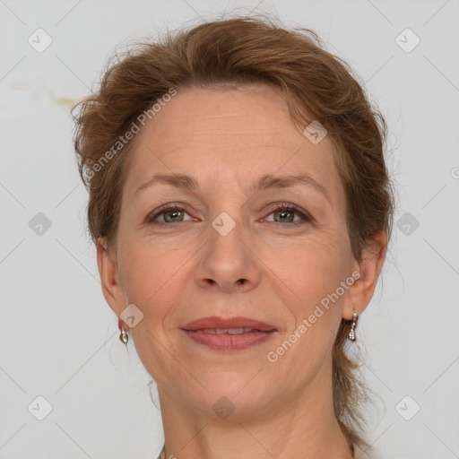 Joyful white adult female with short  brown hair and grey eyes