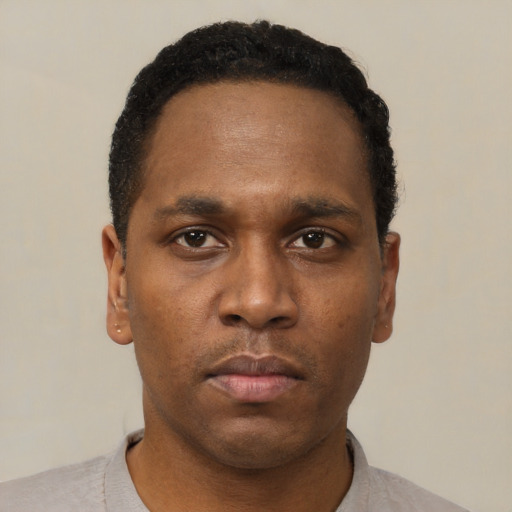Neutral black young-adult male with short  black hair and brown eyes