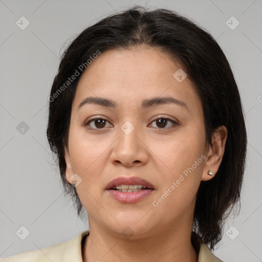 Joyful latino young-adult female with medium  brown hair and brown eyes