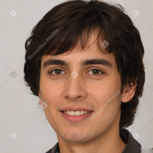 Joyful white young-adult male with medium  brown hair and brown eyes