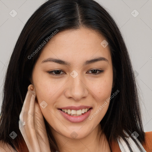 Joyful asian young-adult female with long  brown hair and brown eyes