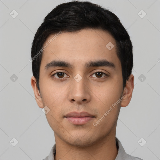 Neutral latino young-adult male with short  black hair and brown eyes