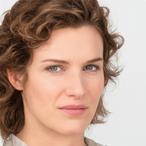 Joyful white young-adult female with medium  brown hair and green eyes