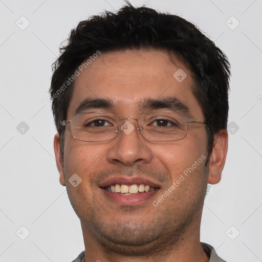 Joyful white young-adult male with short  black hair and brown eyes