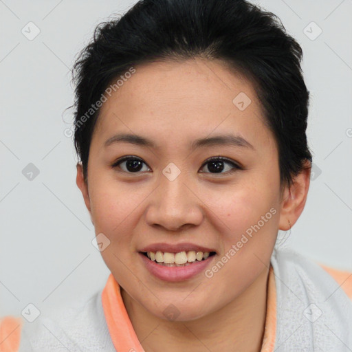 Joyful asian young-adult female with short  brown hair and brown eyes