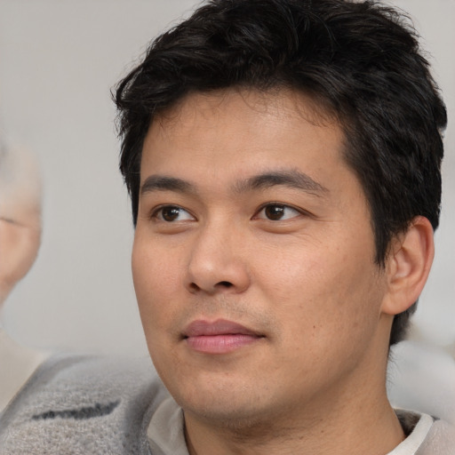 Neutral asian young-adult male with short  brown hair and brown eyes
