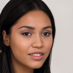 Joyful latino young-adult female with long  brown hair and brown eyes