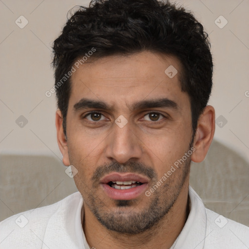 Joyful white young-adult male with short  black hair and brown eyes
