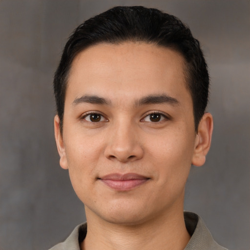 Joyful white young-adult male with short  black hair and brown eyes