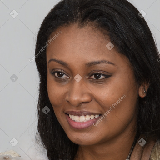 Joyful latino young-adult female with long  brown hair and brown eyes