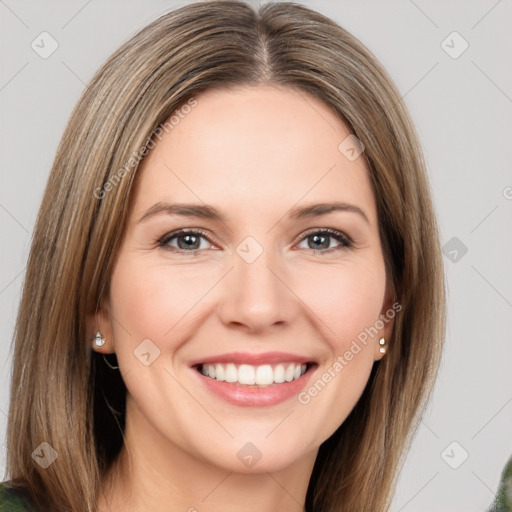 Joyful white young-adult female with medium  brown hair and green eyes